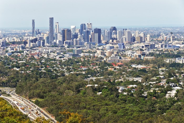 Brisbane cityscape with dense suburban housing and highway