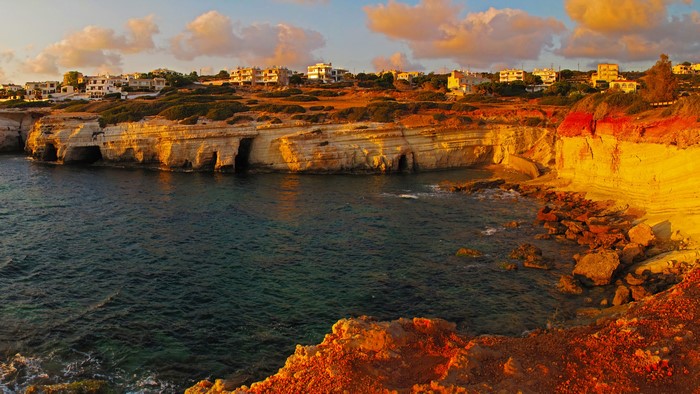 Coastal cliffs and houses in Pegeia, Cyprus