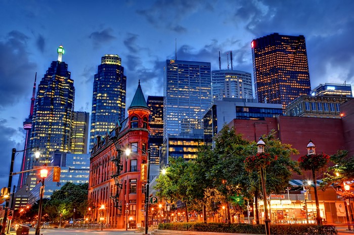 Toronto skyscrapers and historic building at dusk