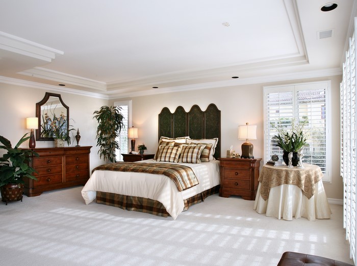 Bedroom with a bed, dresser, and nightstands