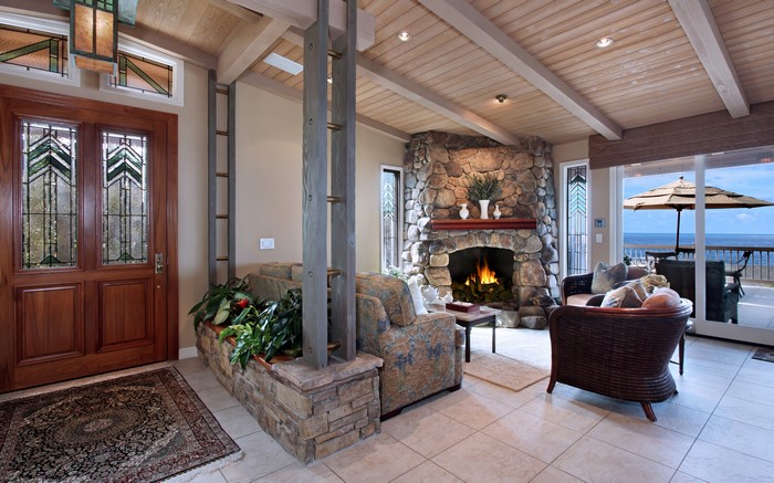 Living room with fireplace and ocean view