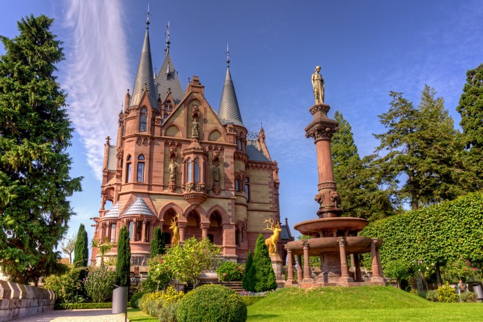 Drachenburg Castle in Germany with a fountain and sculptures