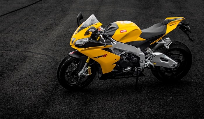 Yellow Aprilia RSV4 Motorcycle on Asphalt