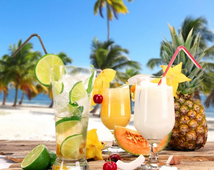 Tropical Drinks on a Beach with Pineapple
