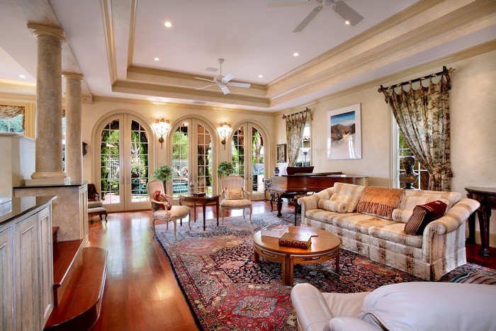 Elegant living room with piano and arched windows