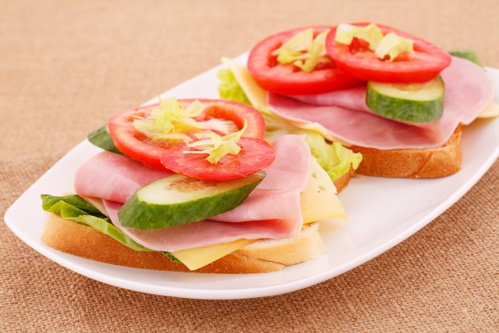 Ham and cheese sandwiches with tomato and cucumber