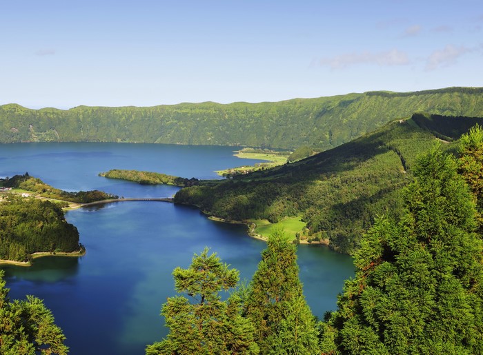 Lake surrounded by green mountains in the Azores, Portugal