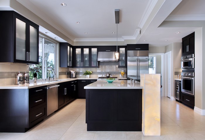 Modern dark wood kitchen with stainless steel appliances