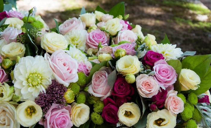 A bouquet of roses, eustoma, and dahlias