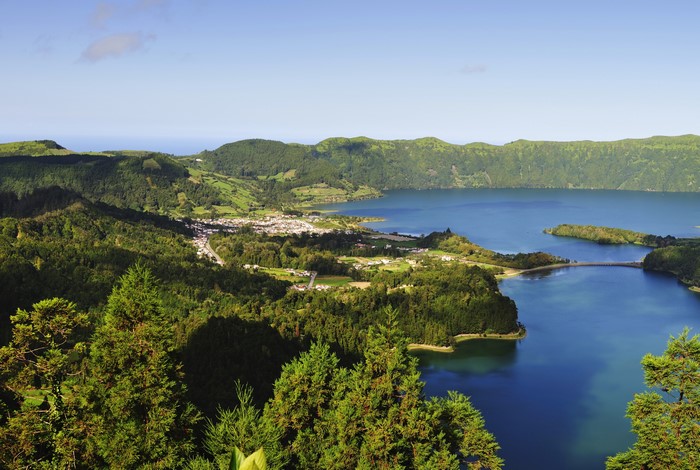 Lake and village surrounded by green hills in the Azores, Portugal