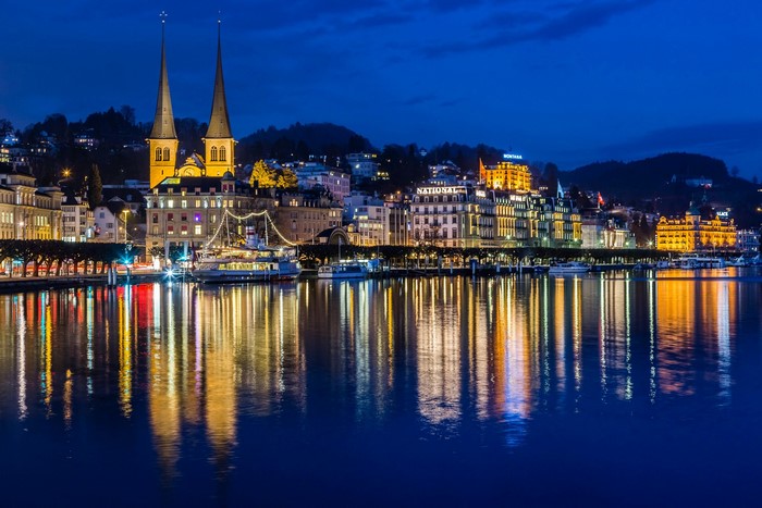 Cityscape of Luzern, Switzerland at night with reflections