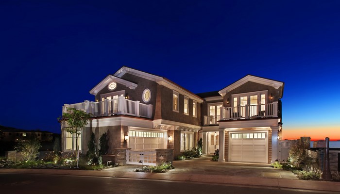 Luxury modern house at dusk with ocean view