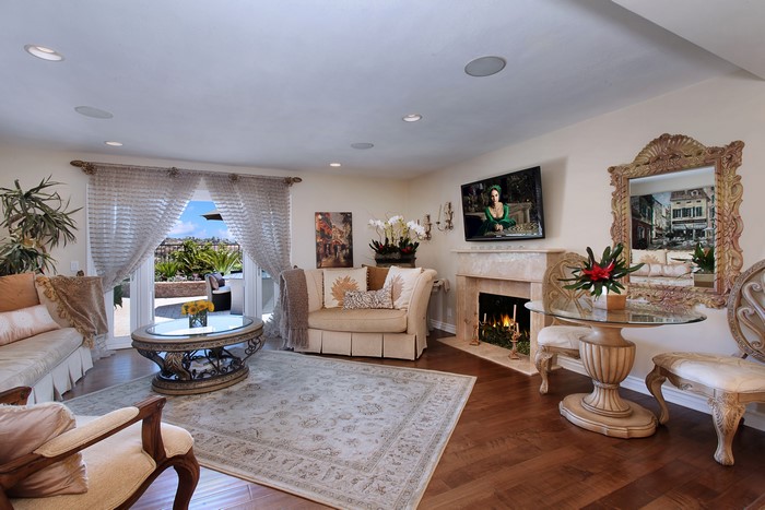 Living room with fireplace, sofa, and coffee table