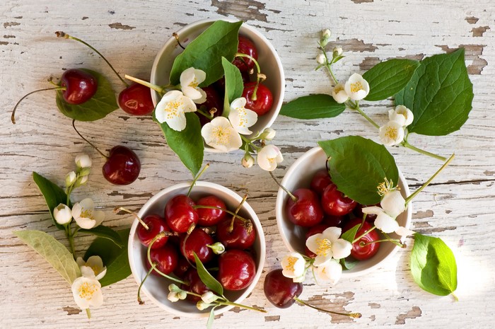 Cherries and Jasmine Flowers on Distressed Wood