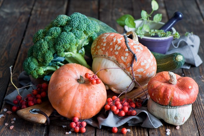 Autumn harvest of pumpkins, broccoli, and berries