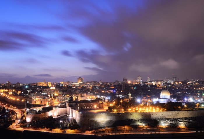 Night view of Jerusalem with illuminated walls and buildings