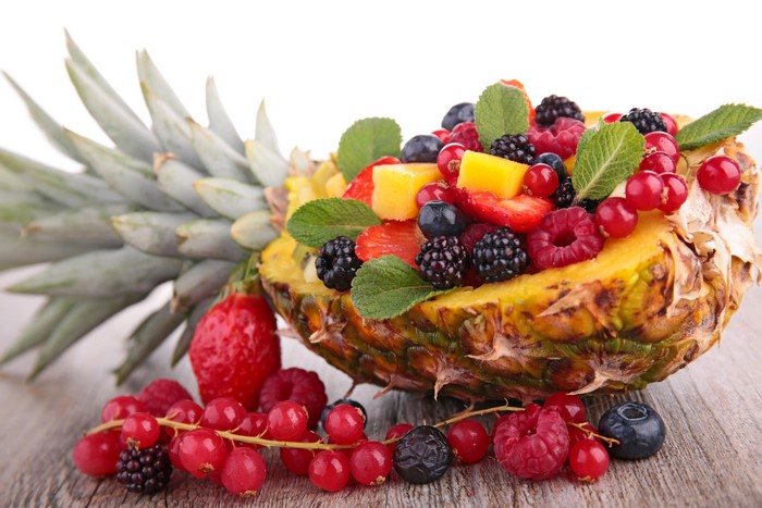 Pineapple filled with berries and fruit