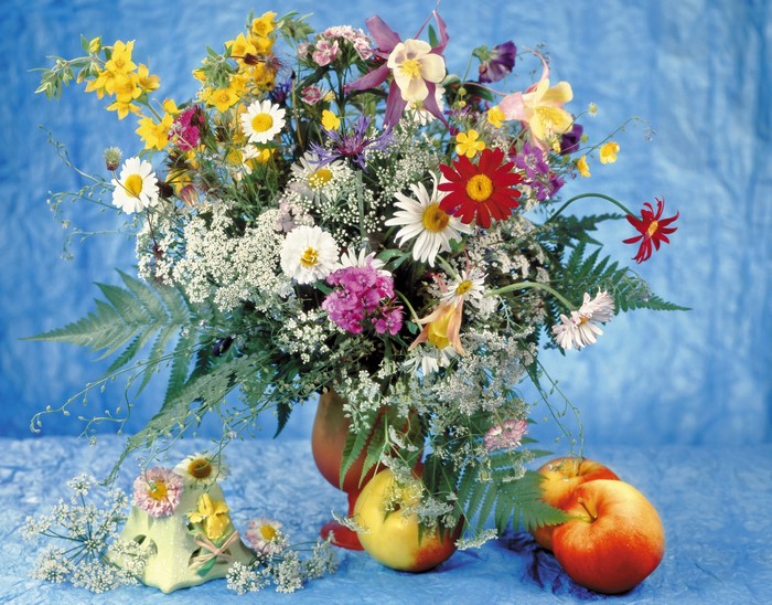 Still-life of a bouquet with apples and a decorative object