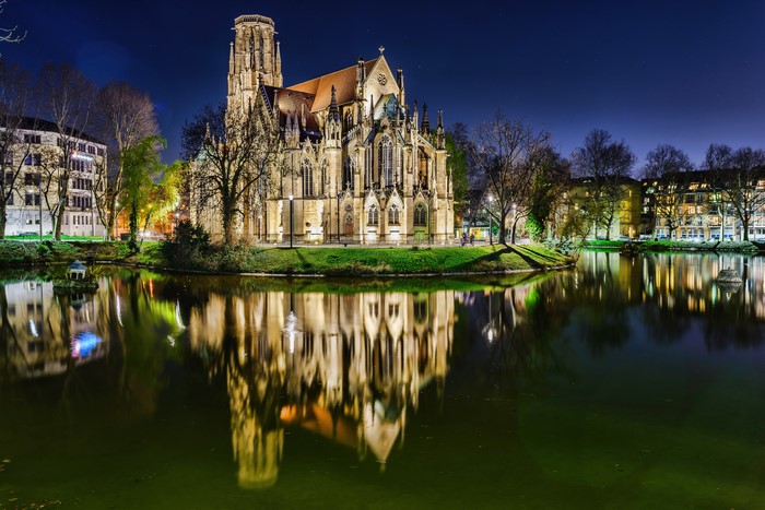 St. John's Church reflected in a lake at night, Stuttgart, Germany