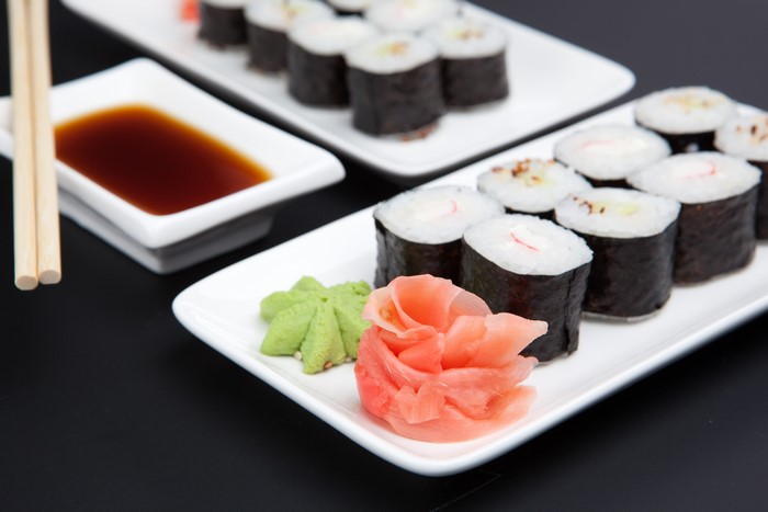 Sushi rolls with soy sauce and chopsticks
