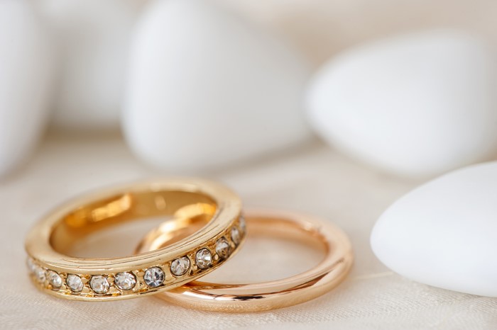 Gold rings with diamonds and white stones