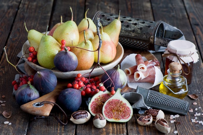 Still-life of pears, figs, ham, and jam