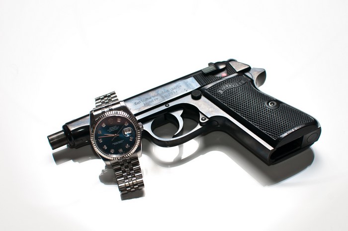 Walther PP pistol with Rolex watch