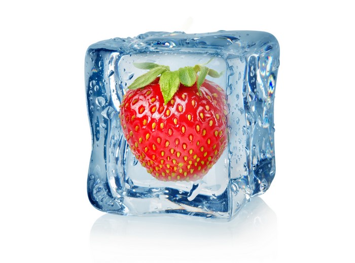 Strawberry frozen in ice cube