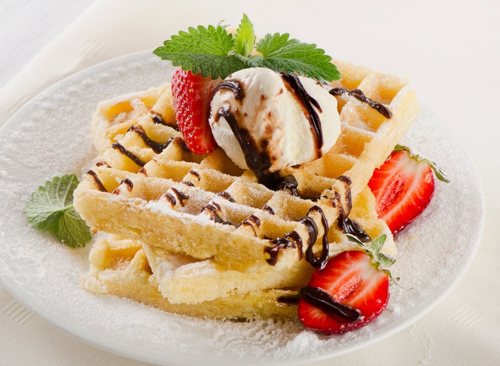 Waffles with Ice Cream, Strawberries, and Chocolate Drizzle