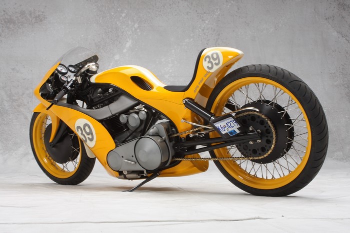 Yellow custom cafe racer motorcycle with number 39