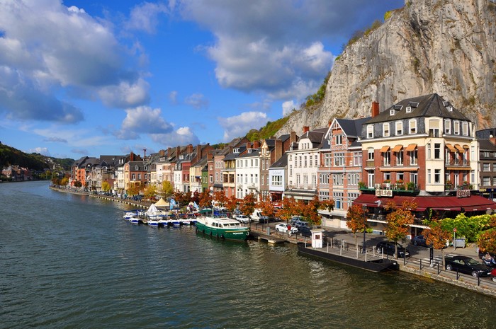 Town on a River with a Cliffside in Dinant, Belgium