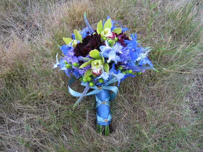 Blue and purple wedding bouquet with orchids and dahlias