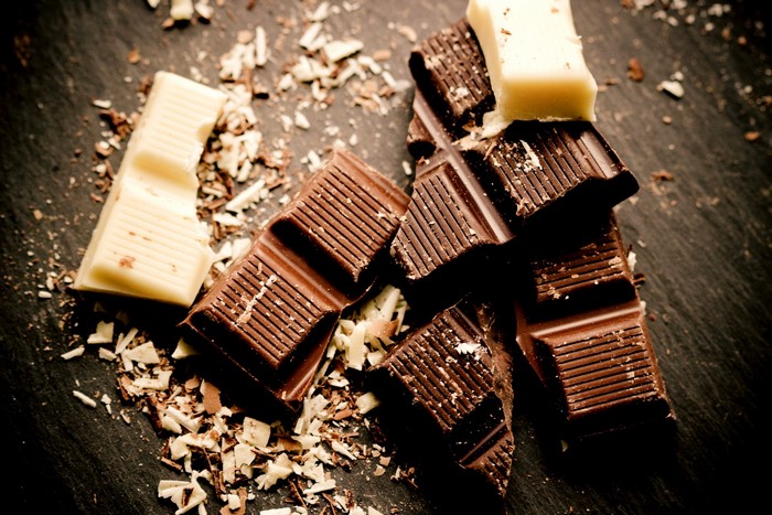Chocolate bars and shavings on a dark surface