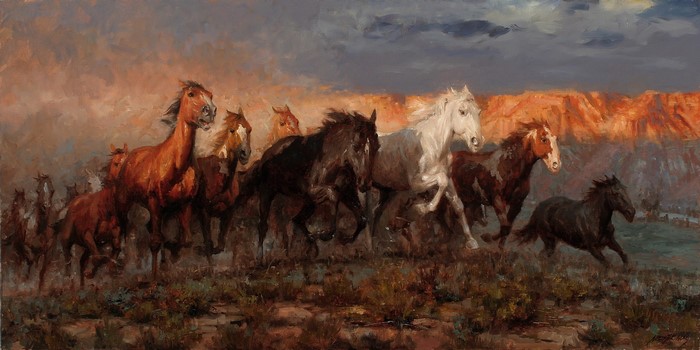 Wild Horses Running Against a Dramatic Sky