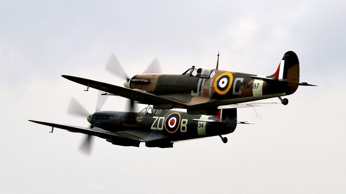 Two Supermarine Spitfire airplanes in flight