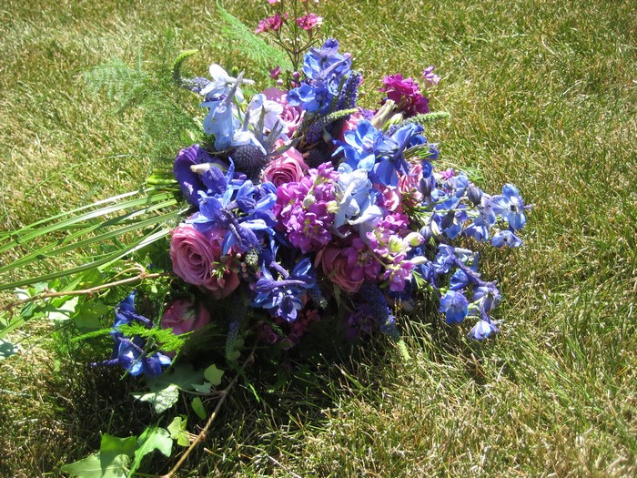 Bouquet of Roses and Lupinus on Grass