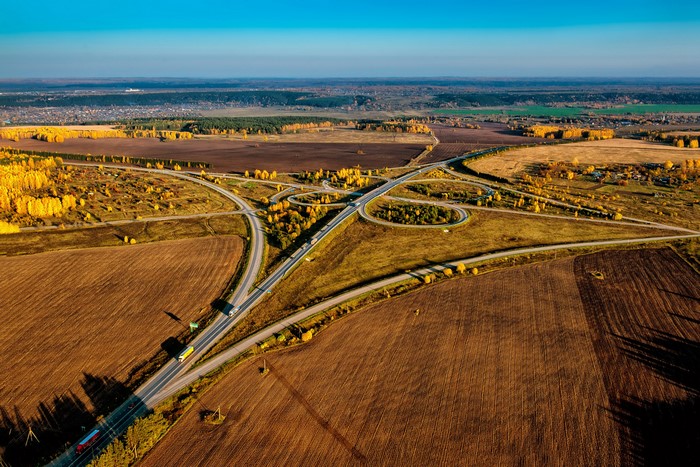 Aerial view of a highway interchange in autumn Russia