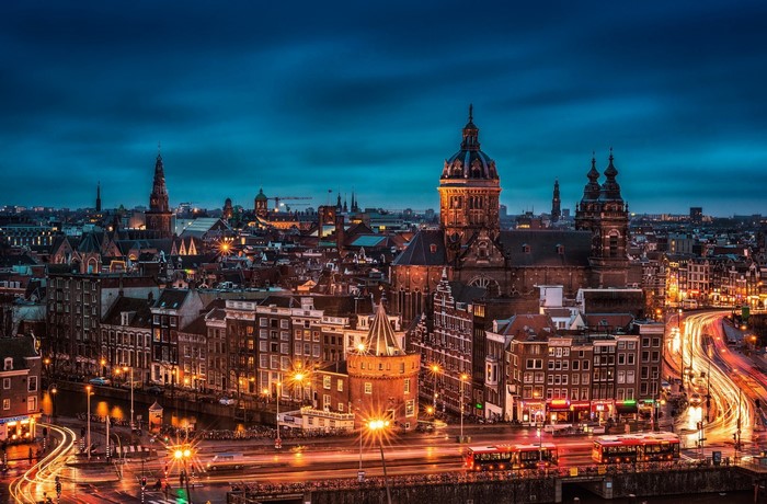 Amsterdam cityscape at night with canals and lights