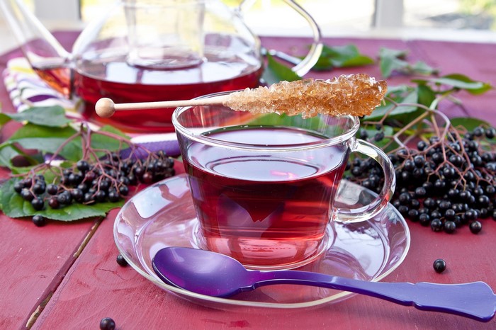 Elderberry tea with rock candy and spoon