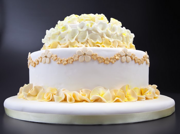 White and yellow floral tiered cake
