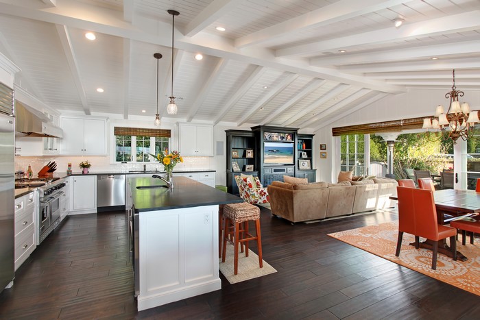 Open concept kitchen and living room with vaulted ceiling