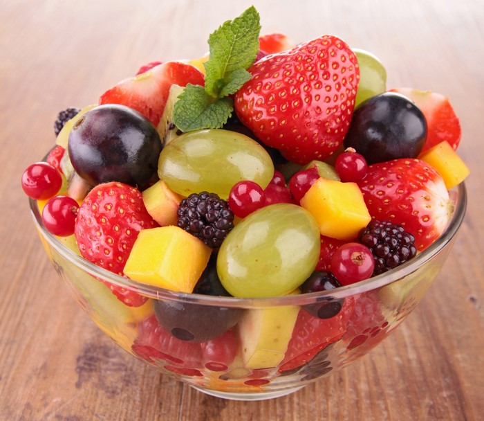 Fruit salad with strawberries, blackberries, grapes, and mint