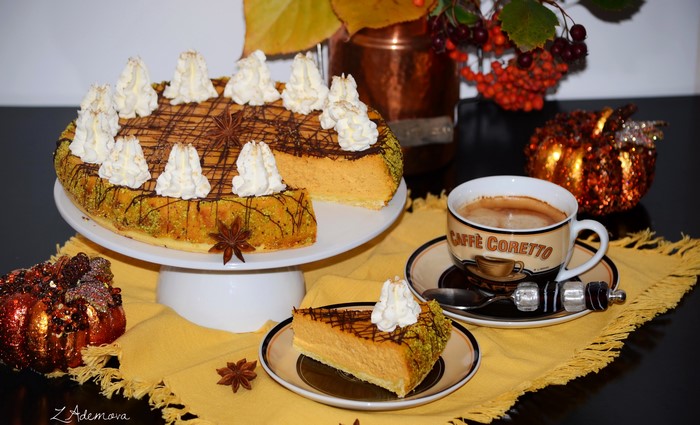 Pumpkin cheesecake with coffee and autumn decorations