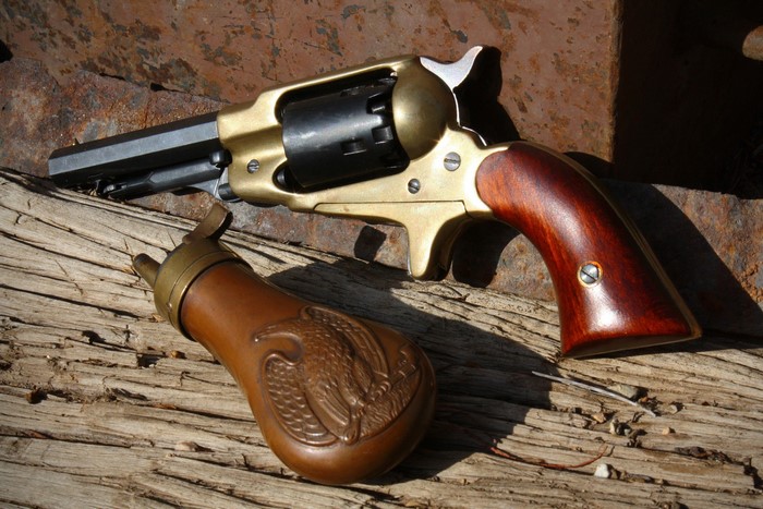 Colt Navy Revolver and Powder Flask
