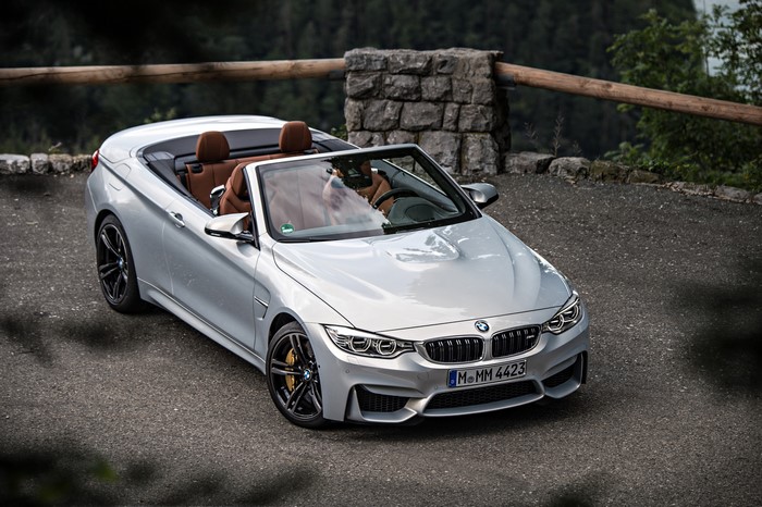 Silver BMW M4 Convertible parked on a road