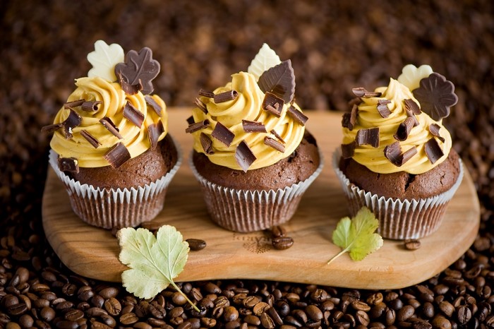 Chocolate cupcakes with caramel frosting and chocolate shavings