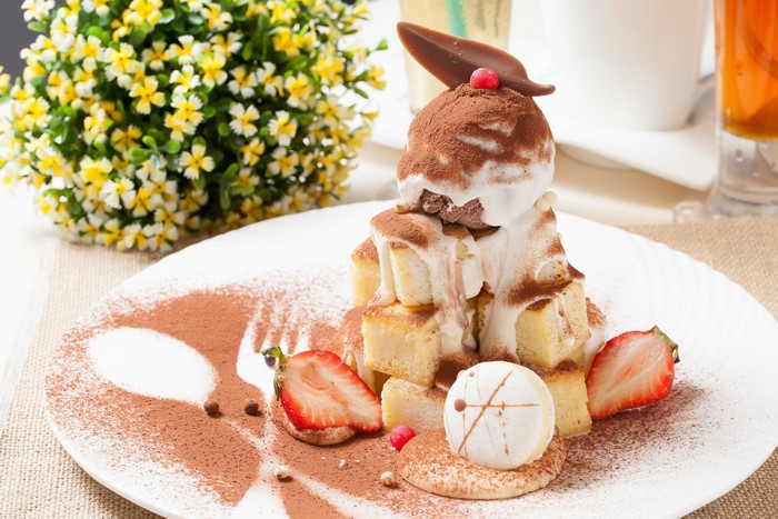 Dessert with ice cream and strawberries on a plate