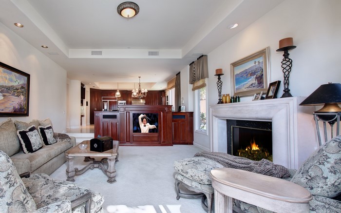 Living room with fireplace and kitchen