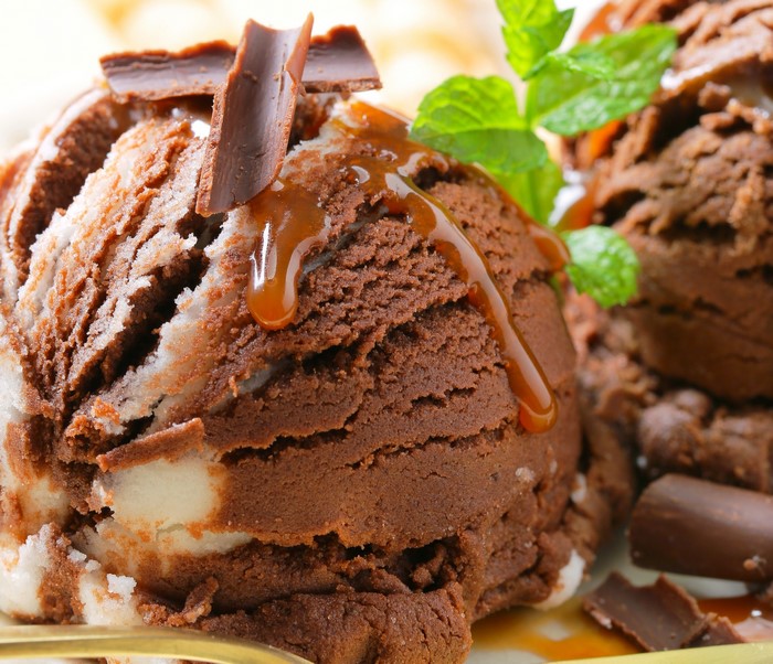 Chocolate and vanilla ice cream with caramel and chocolate shavings