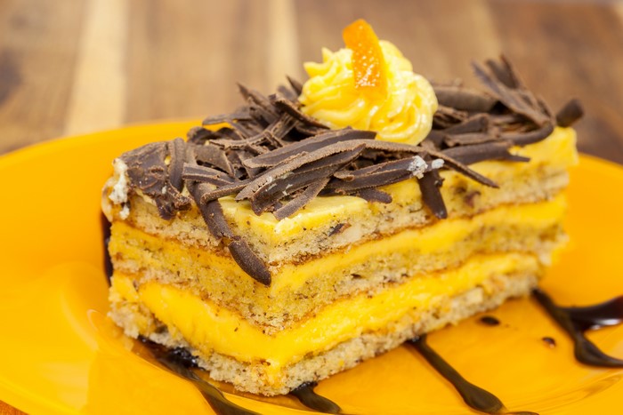 Slice of layered cake with chocolate shavings